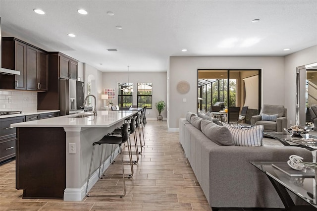 12654 Oak Hill Way, Parrish, FL 34219 - living room featuring recessed lighting, baseboards, and wood finish floors
