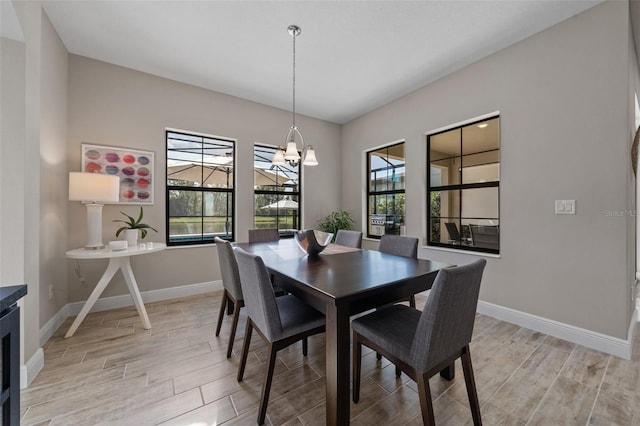12654 Oak Hill Way, Parrish, FL 34219 - dining area with wood finish floors, baseboards, and healthy amount of natural light