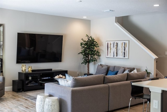 12654 Oak Hill Way, Parrish, FL 34219 - living room featuring stairs, light wood-type flooring, and recessed lighting