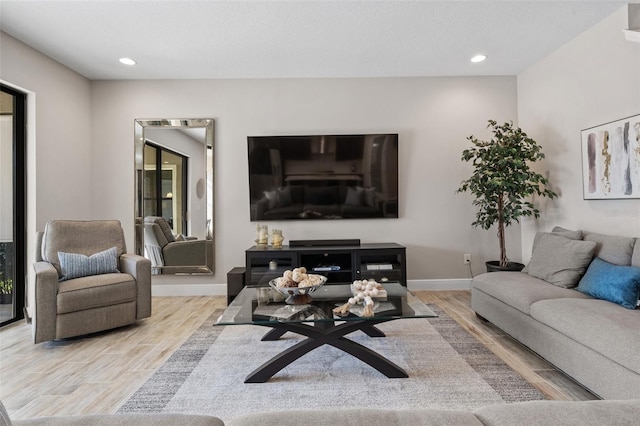 12654 Oak Hill Way, Parrish, FL 34219 - living room featuring wood finished floors, recessed lighting, and baseboards