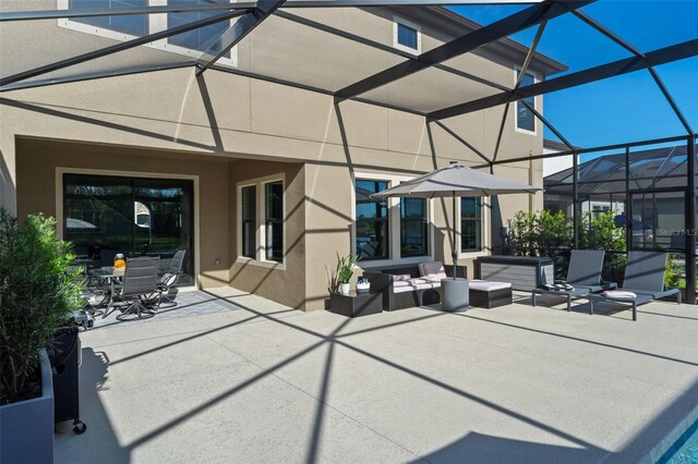 12654 Oak Hill Way, Parrish, FL 34219 - view of patio / terrace with glass enclosure, outdoor dining space, and an outdoor hangout area