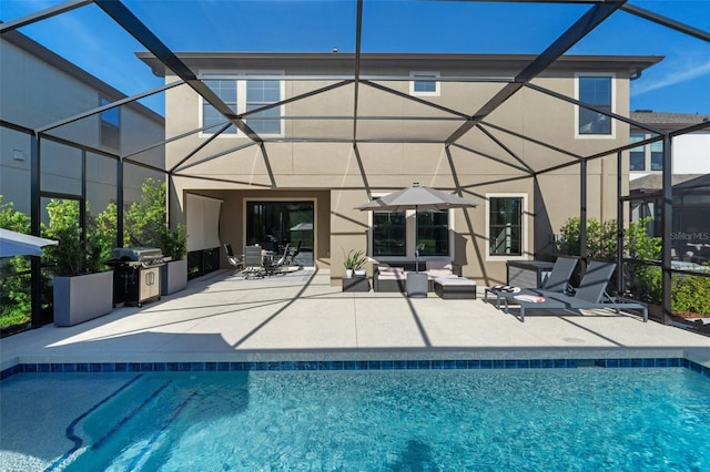 12654 Oak Hill Way, Parrish, FL 34219 - back of property featuring glass enclosure, stucco siding, a patio area, and an outdoor pool