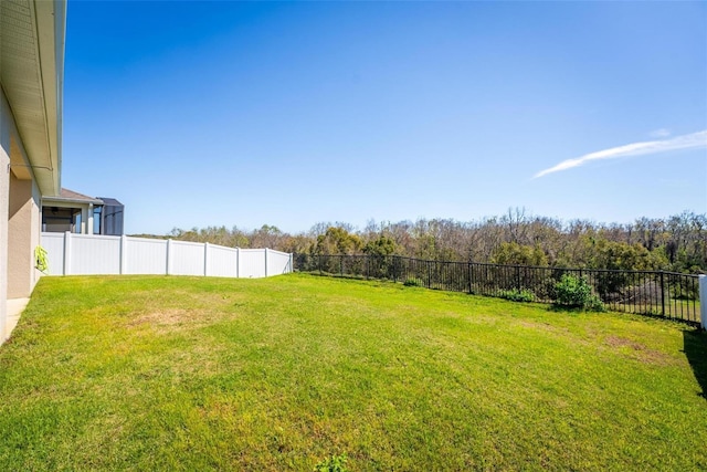 view of yard with a fenced backyard