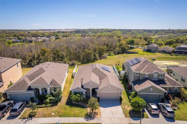 aerial view featuring a residential view and a forest view