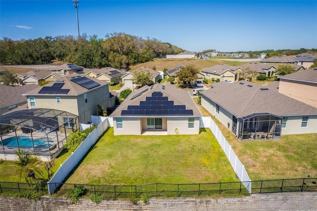 birds eye view of property with a residential view