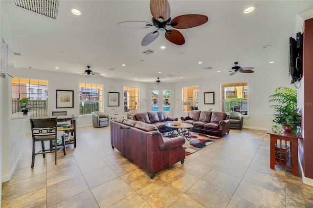 living room with light tile patterned floors, visible vents, recessed lighting, and baseboards