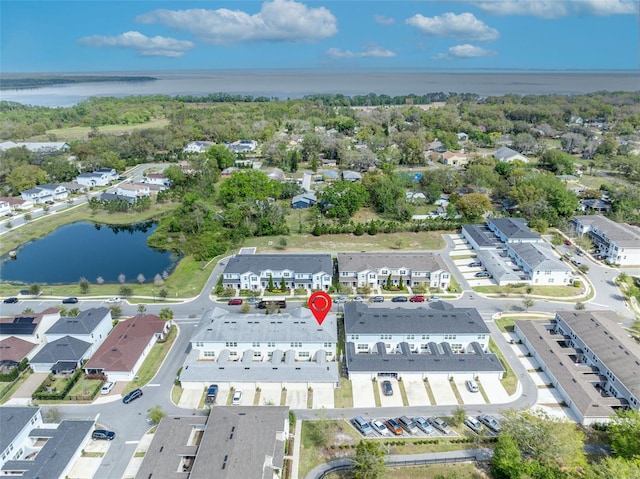 birds eye view of property featuring a water view and a residential view