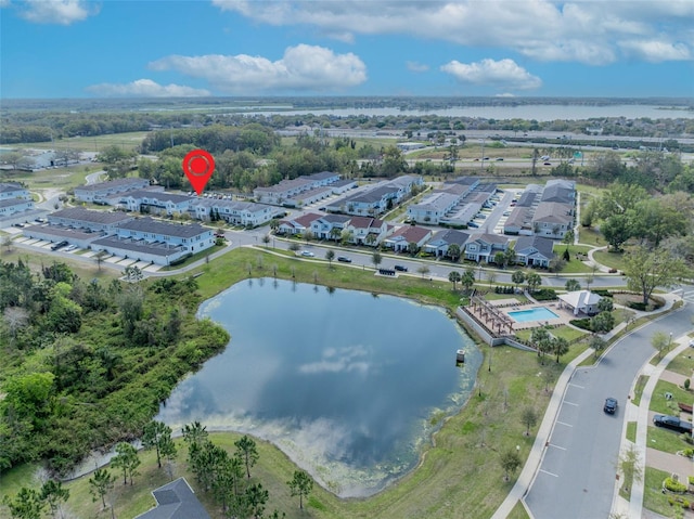 drone / aerial view with a residential view and a water view