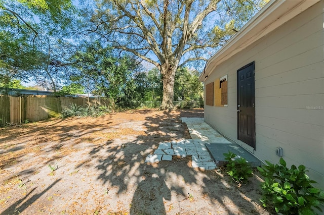 view of yard featuring a fenced backyard and a patio area