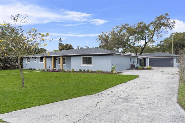 single story home featuring a front lawn, central AC, stucco siding, a garage, and driveway