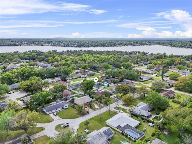 birds eye view of property with a residential view and a water view