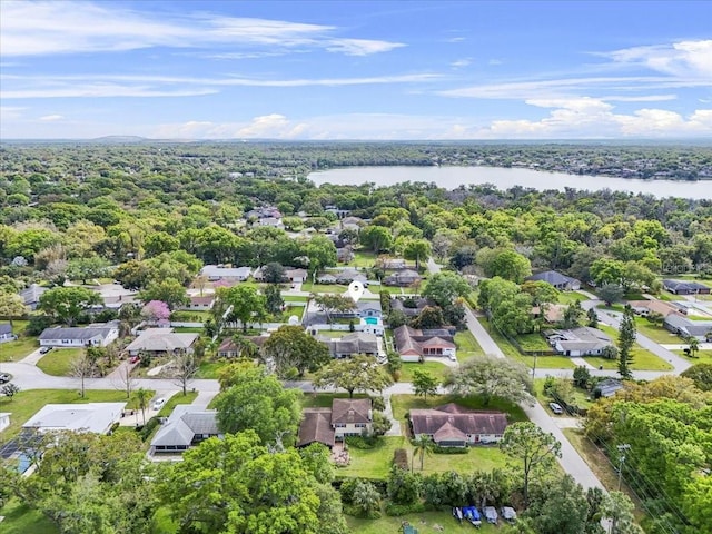 drone / aerial view featuring a water view and a residential view