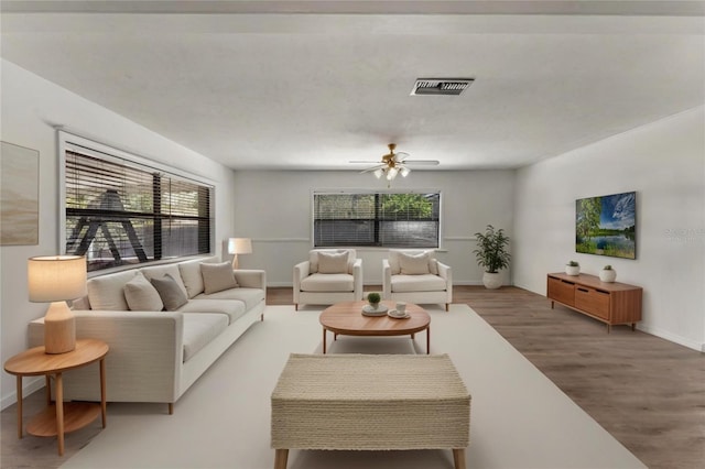 1021 Mare Bello Dr, Winter Park, FL 32792 - living room featuring baseboards, ceiling fan, wood finished floors, and visible vents
