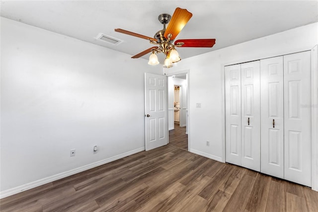 1021 Mare Bello Dr, Winter Park, FL 32792 - unfurnished bedroom featuring a ceiling fan, visible vents, wood finished floors, baseboards, and a closet