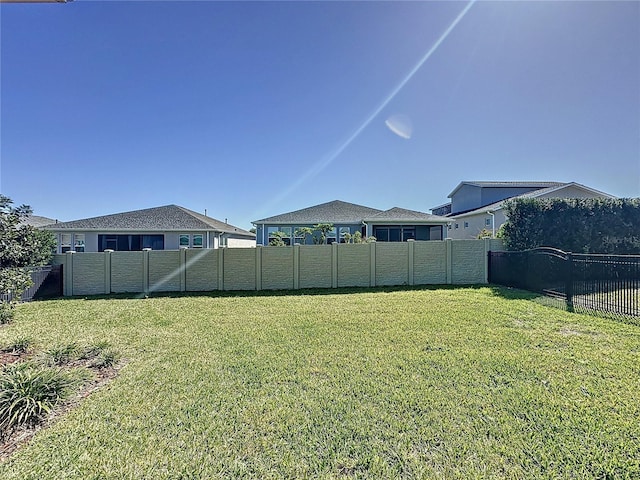 view of yard with a fenced backyard