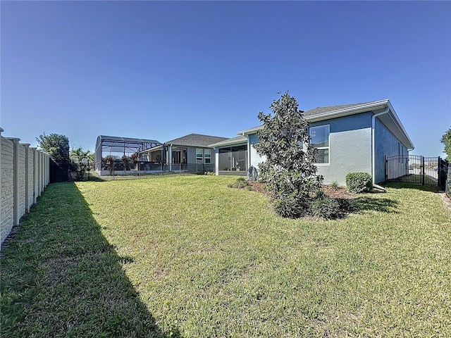 view of yard with a fenced backyard