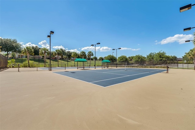 view of sport court featuring community basketball court and fence