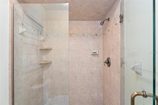 full bath with a shower stall