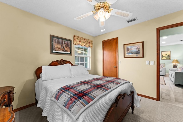 bedroom with visible vents, ceiling fan, baseboards, and carpet floors