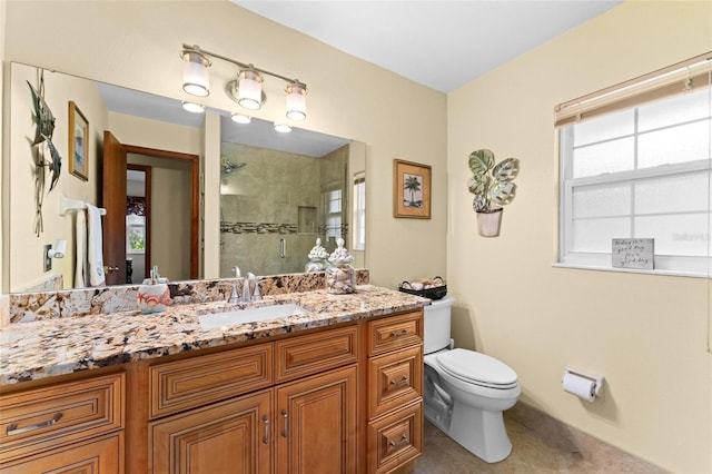 full bath with tile patterned flooring, a shower stall, toilet, and vanity