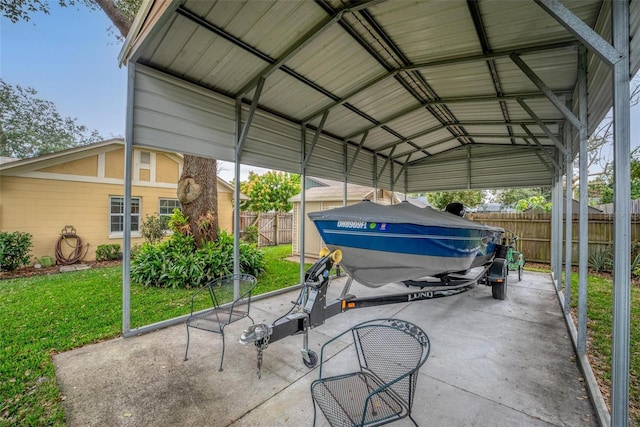 view of car parking with a detached carport and fence