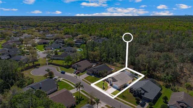 aerial view featuring a residential view and a view of trees