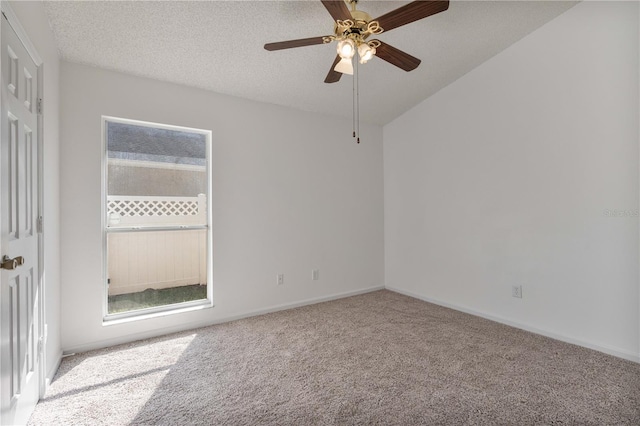 spare room with a ceiling fan, baseboards, carpet floors, and a textured ceiling