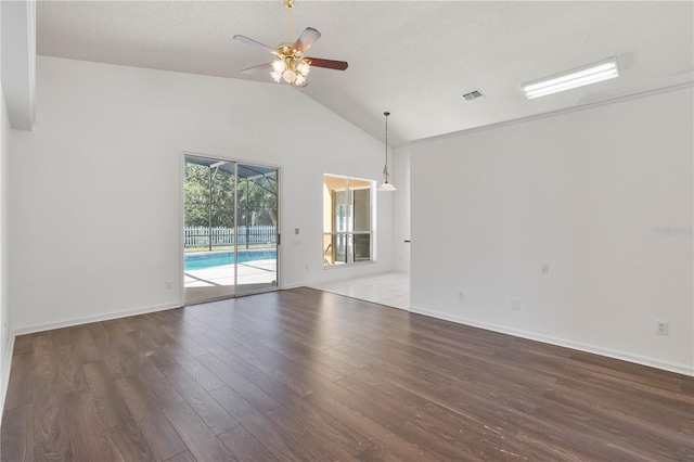 unfurnished room featuring visible vents, a ceiling fan, a textured ceiling, wood finished floors, and baseboards