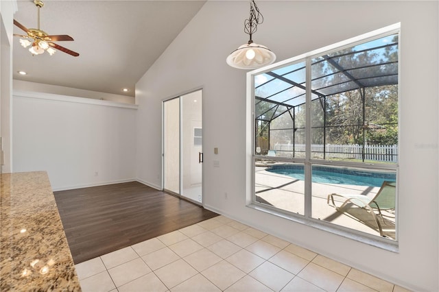 interior space featuring recessed lighting, plenty of natural light, high vaulted ceiling, and a ceiling fan