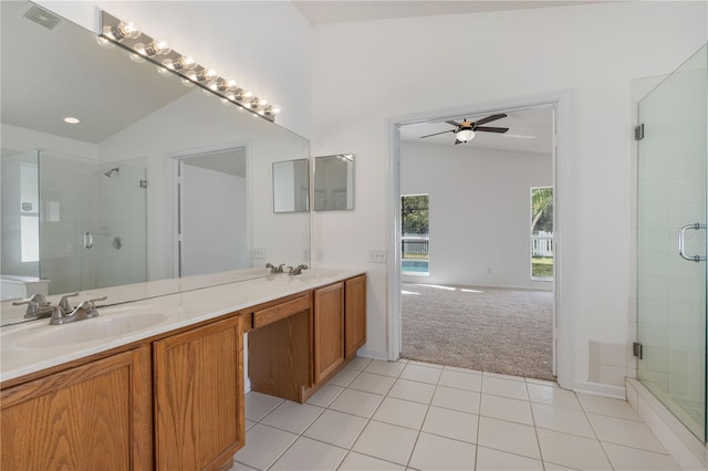 full bathroom with a shower stall, visible vents, tile patterned floors, and a sink