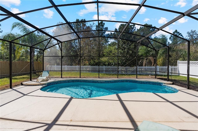 view of pool with a lanai, a fenced in pool, a patio, and a fenced backyard