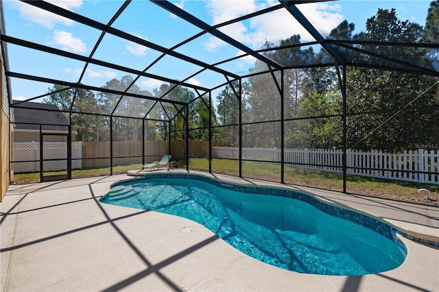 view of pool featuring a lanai, a fenced in pool, a fenced backyard, and a patio area