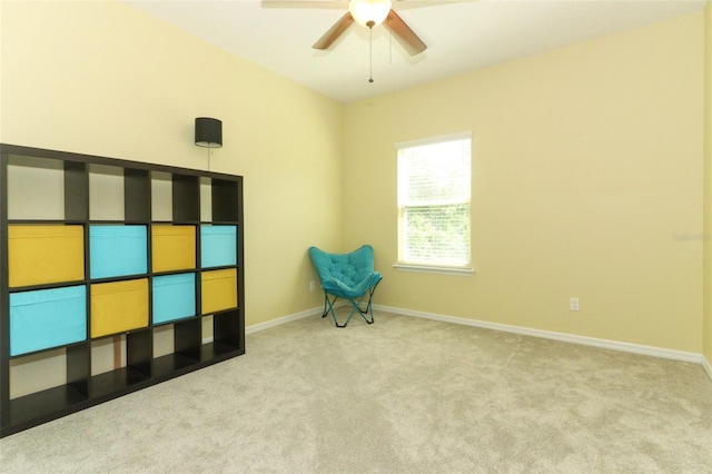 unfurnished room featuring baseboards, a ceiling fan, and carpet floors