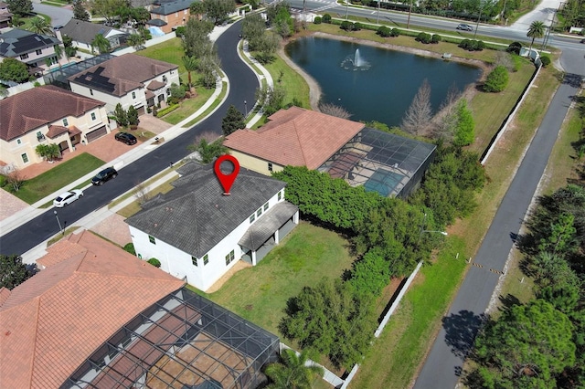 bird's eye view featuring a water view and a residential view