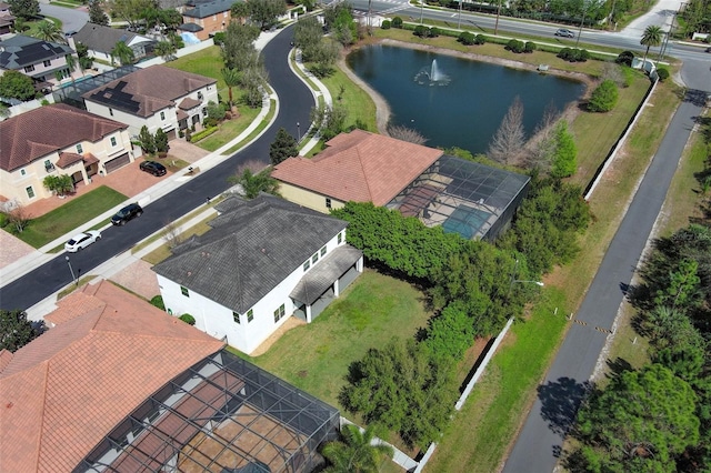 bird's eye view with a water view and a residential view