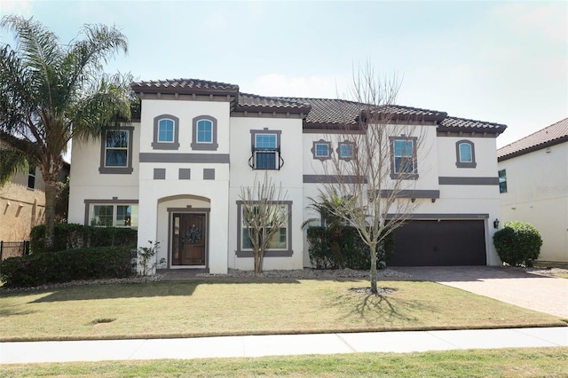 2351 Kelbrook Ct, Oviedo, FL 32765 - mediterranean / spanish-style home with an attached garage, a tiled roof, stucco siding, and driveway