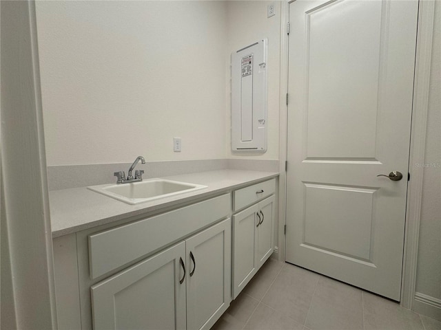 bathroom with tile patterned floors, electric panel, and vanity