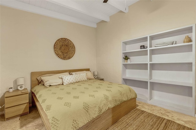 bedroom with beam ceiling and a ceiling fan