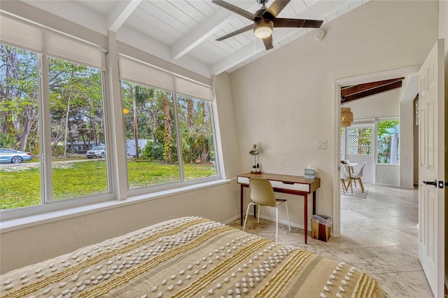 bedroom featuring lofted ceiling with beams, a textured wall, baseboards, and ceiling fan