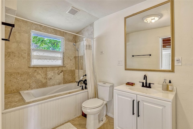 bathroom with visible vents, toilet, shower / tub combo, a textured ceiling, and vanity