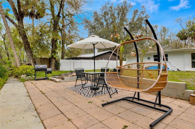 view of patio with fence private yard and outdoor dining area