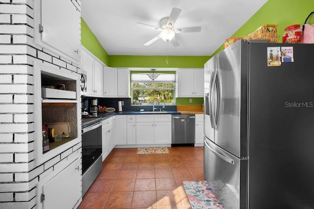 kitchen featuring a sink, white cabinetry, and stainless steel appliances