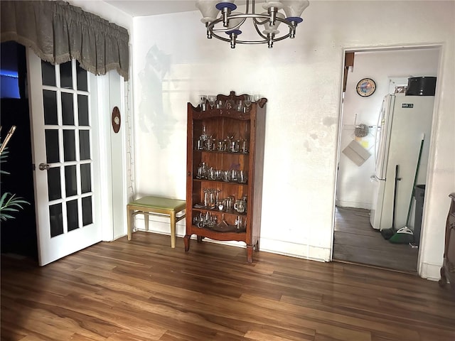 dining room featuring a notable chandelier and wood finished floors