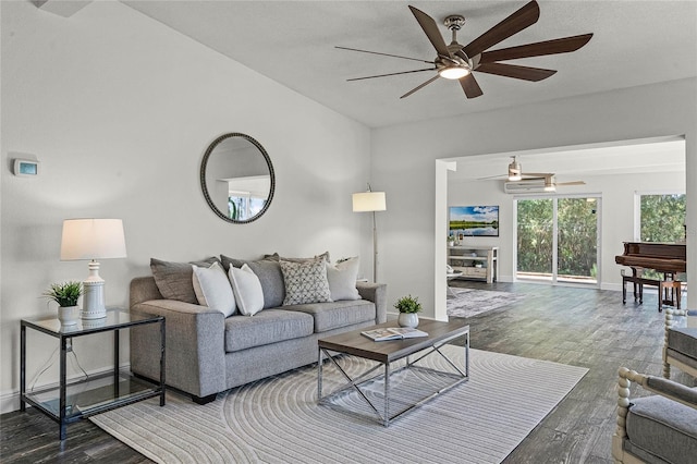 living room featuring wood finished floors, baseboards, and ceiling fan