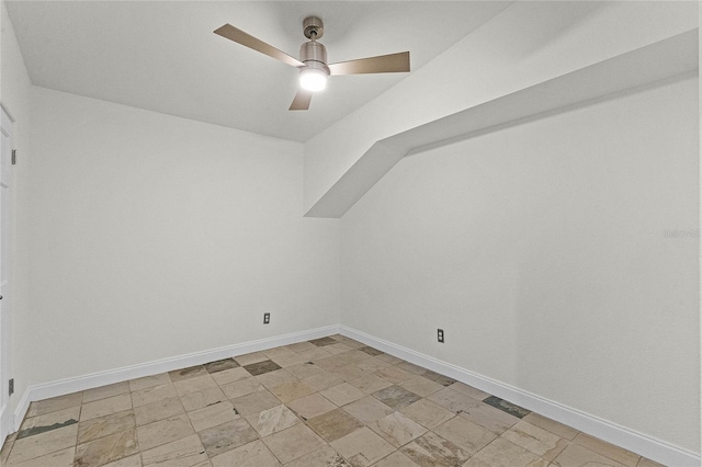 additional living space featuring baseboards and ceiling fan