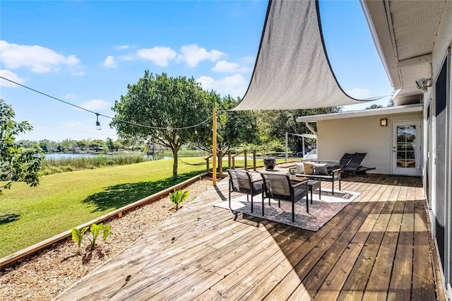 wooden deck with an outdoor living space and a yard