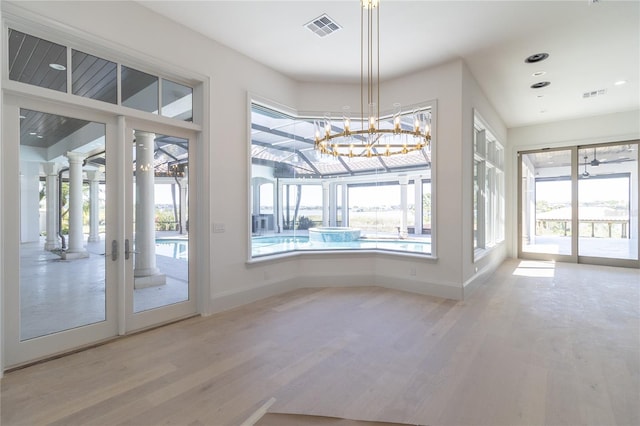 interior space featuring plenty of natural light and visible vents