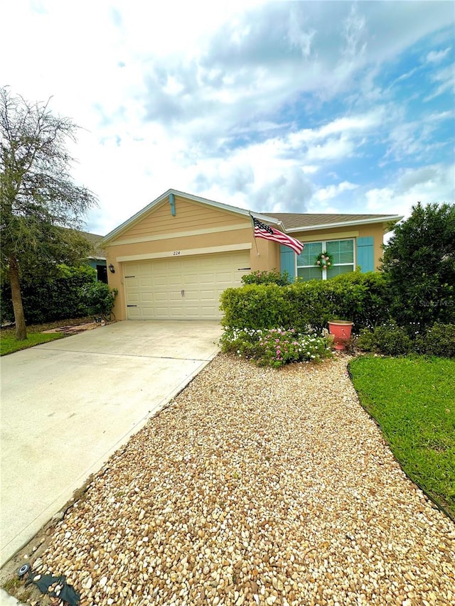 ranch-style house with a garage and concrete driveway