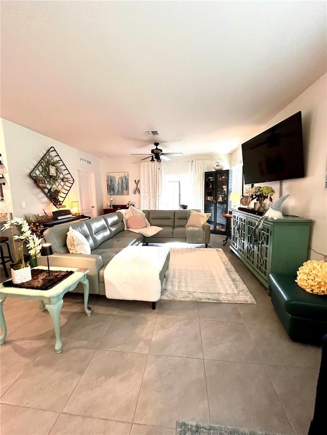 living room featuring visible vents and ceiling fan