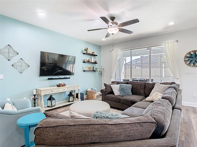 living area featuring recessed lighting, baseboards, wood finished floors, and a ceiling fan